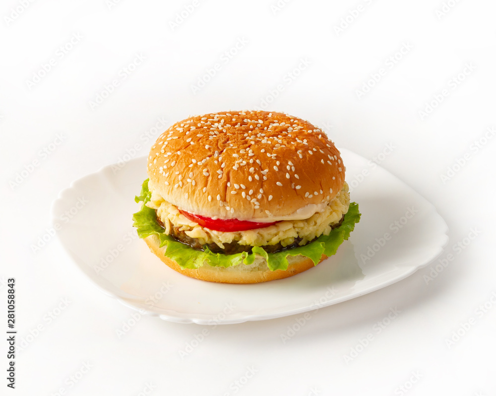 Burger on a plate side view Burger on a plate side view