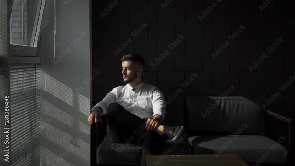 young man with a beard turning his head and look at camera. Business man in office. Slow motion 120pfps young man with a beard turning his head and look at camera. Business man in office. Slow motion 120pfps