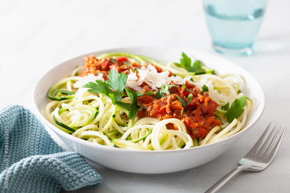 keto paleo zoodles bolognese: zucchini noodles with meat sauce and parmesan