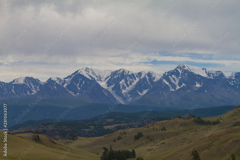 Snow tops in Altai mountains. Summer travel concept. Beautiful landscape.
