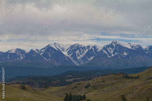 Snow tops in Altai mountains. Summer travel concept. Beautiful landscape.