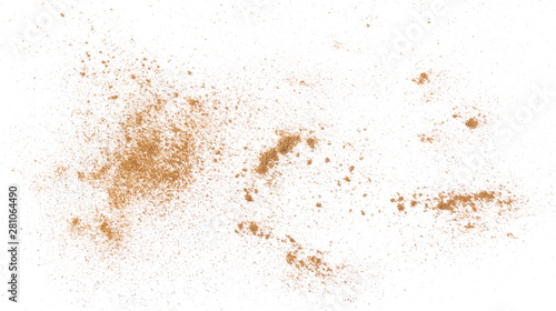 Fotografia Cinnamon powder isolated on white background, top view