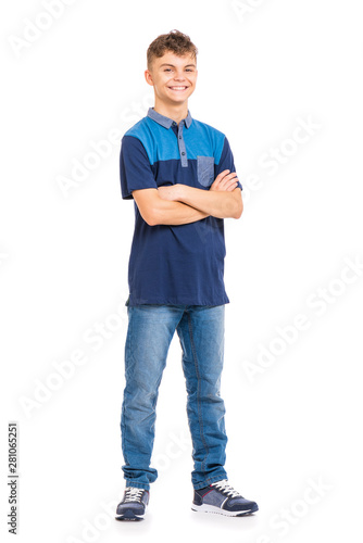 Full length portrait of young caucasian teen boy isolated on white background. Funny teenager with arms folded. Handsome child looking at camera and smiling.