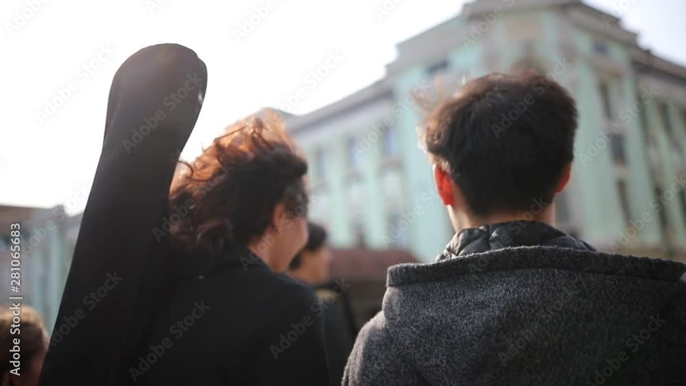 Young friends walking on the crowded street Young friends walking on the crowded street