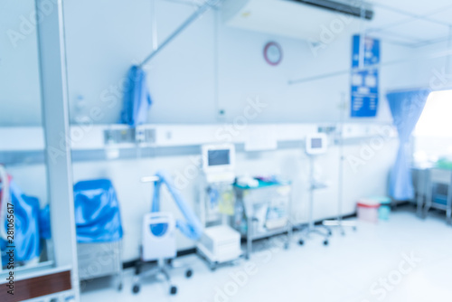 Blurry empty interior operating room and modern equipment in hospital.Medical device for surgeon surgical emergency patient in blue tone style.Save life medical treatment concept.