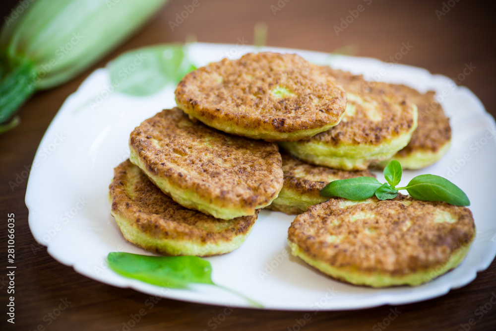 vegetable fritters made from green zucchini in a plate vegetable fritters made from green zucchini in a plate