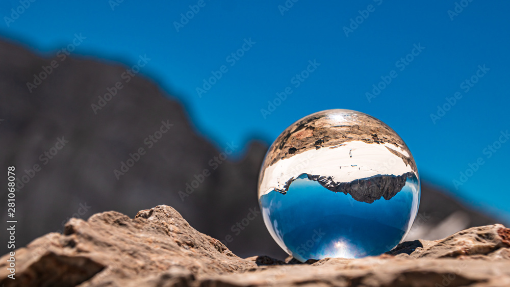 Crystal ball alpine landscape shot at the famous Dachstein summit, Schladming, Steiermark, Austria
