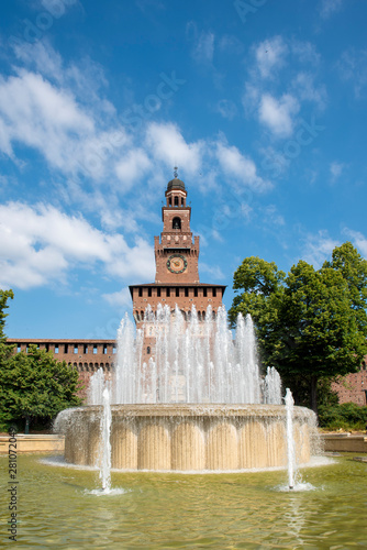 Main entrance to the Sforza Castle - Castello Sforzesco and fountain in front of it, Milan, Italy