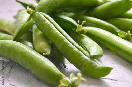 many of Green Pea Pods on factured surface