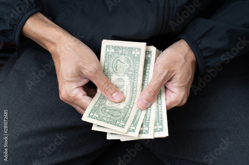 Close up of poor man hand with small money