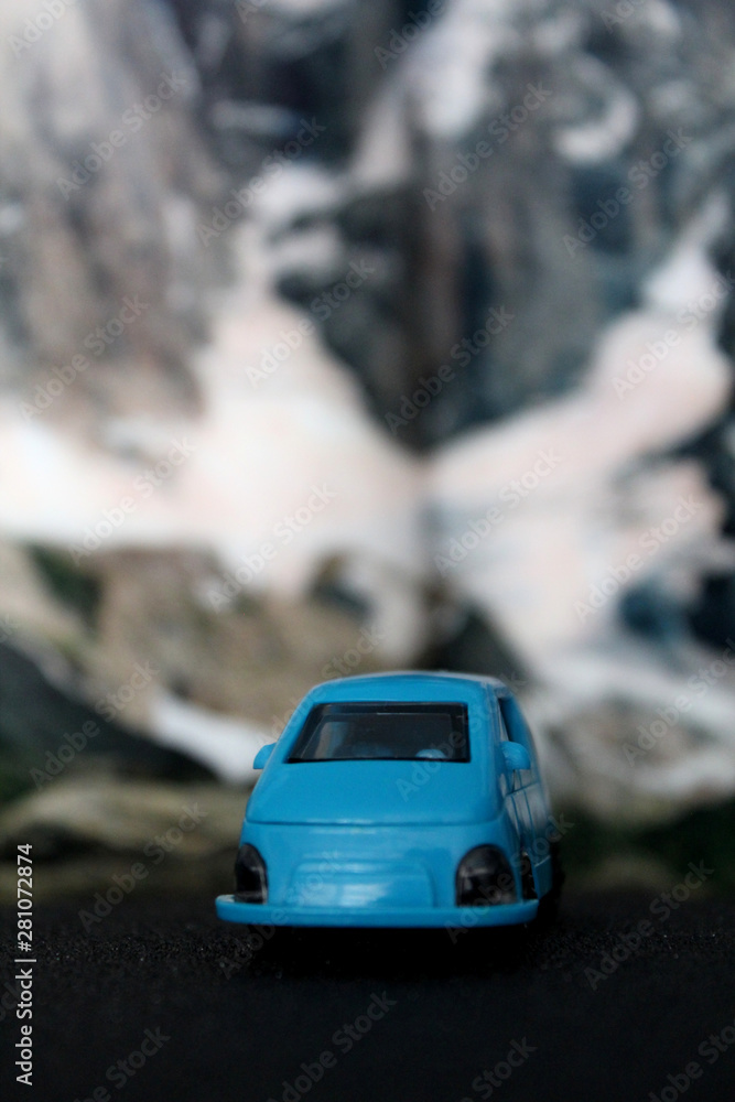 blue toy car on the road