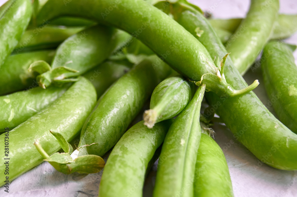 many of Green Pea Pods on factured surface many of Green Pea Pods on factured surface