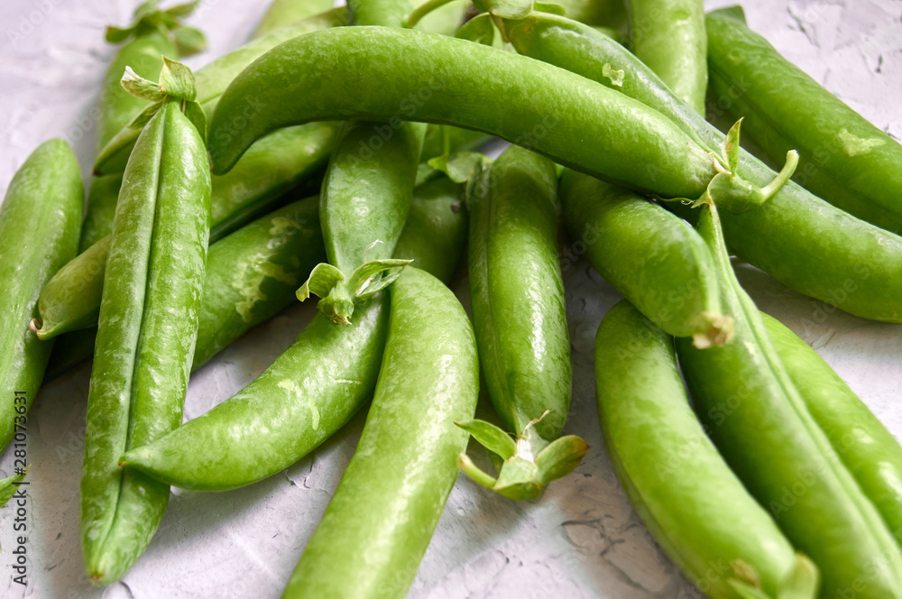 many of Green Pea Pods on factured surface many of Green Pea Pods on factured surface