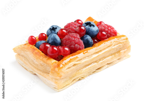 Fresh delicious puff pastry with sweet berries on white background