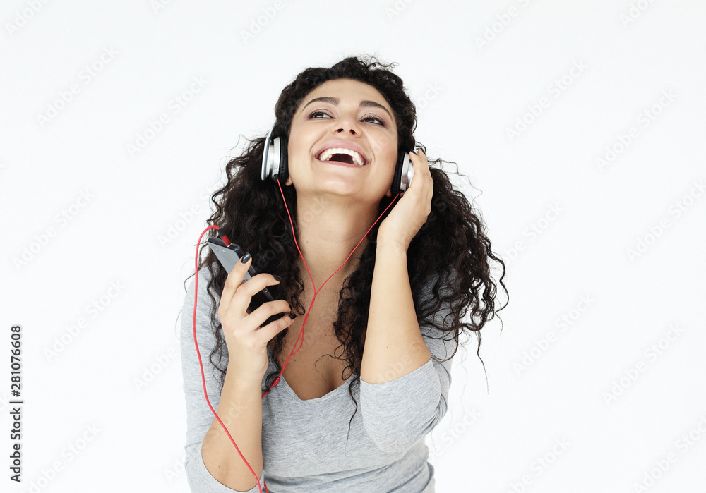 lifestyle and people concept: young woman at home and listening to music with headphones lifestyle and people concept: young woman at home and listening to music with headphones