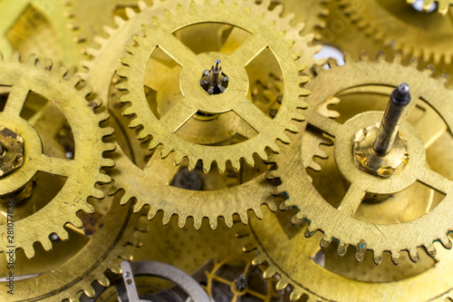 Cog-wheels of the old broken clock close up.