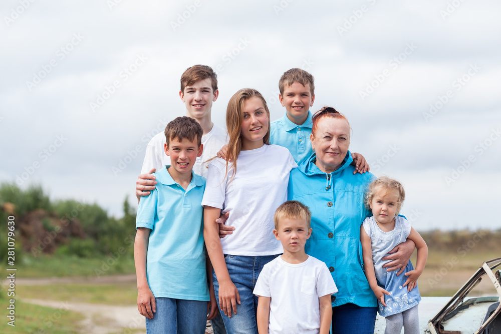Most beautiful happy family in summer village, portrait of two generations, grandparents with grandchildren, outdoor