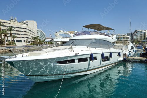 View of the Gulf of Eilat with luxury yachts. On the yacht you can sunbathe, jump into the open sea and enjoy drinks and fruits.