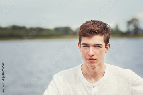 close up of teen boy, Portrait of a handsome young man on a background of nature