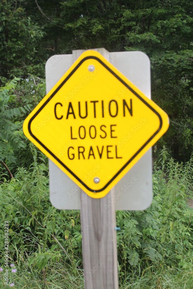 caution loose gravel sign