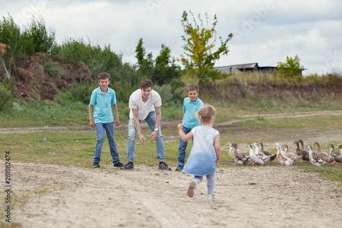 Group of happy cheerful beautiful children running in park, outdoor