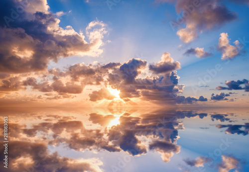 evening sky, sunset sky and clouds over ocean water -