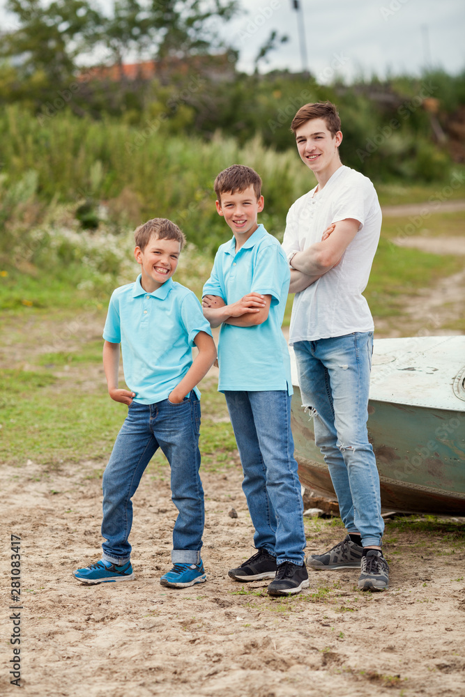 Portrait of happy brothers on the background of nature, outdoor, Portrait of happy brothers on the background of nature, outdoor,