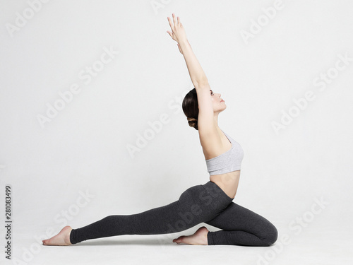 Portrait of attractive woman doing yoga, pilates. Healthy lifestyle and sports concept.