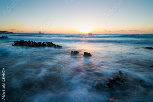 Landscape with blue turquoise water and many rocks in Tenerife Spain.