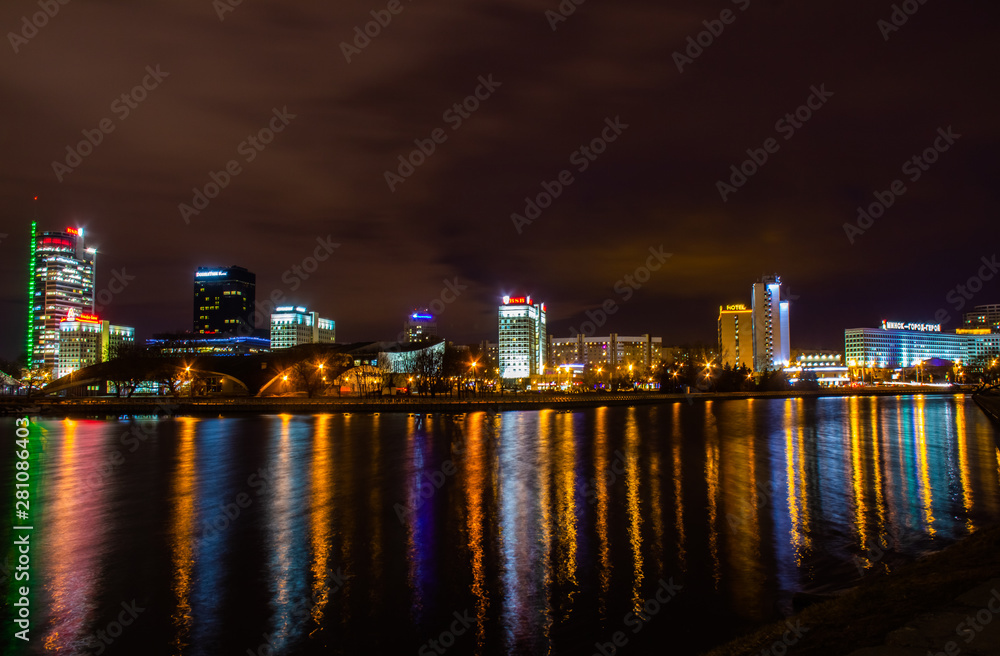 Reflection of the city night illumination of Minsk in the river Svisloch Reflection of the city night illumination of Minsk in the river Svisloch