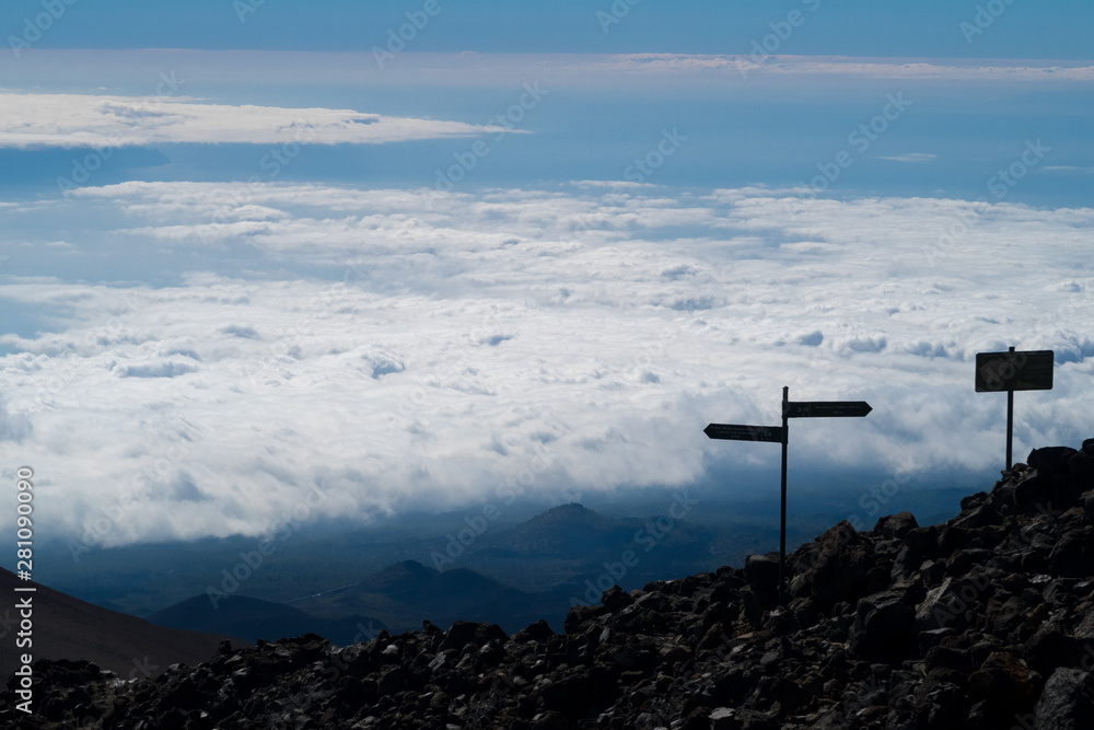 On the summit of volcano El Teide in Tenerife Spain. A beautiful cloudscape over the horizon.