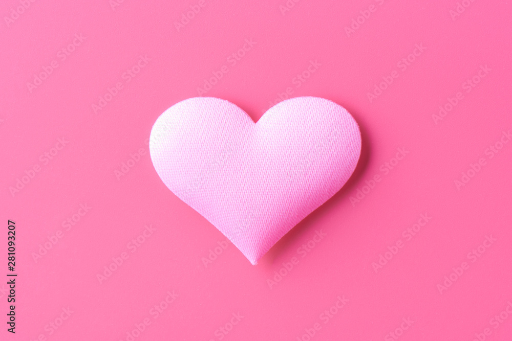 Volume heart on a pink background, a symbol of love and loyalty