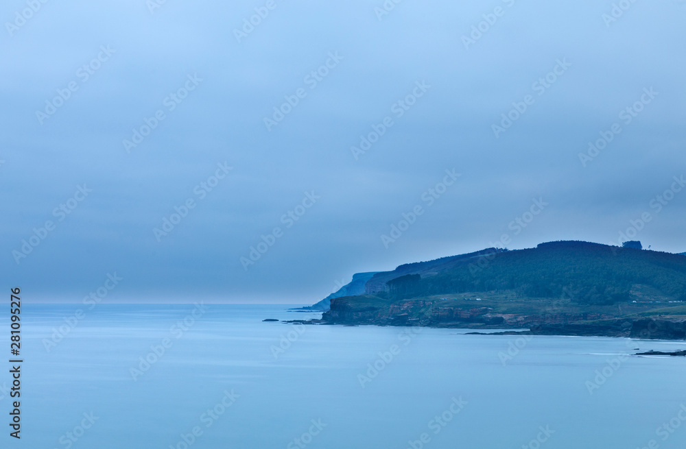 Coastline at dawn on a cloudy day Coastline at dawn on a cloudy day