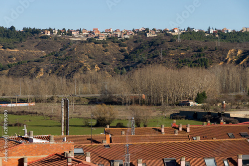 Urbanización en una colina vista desde otra urbanización abaj photo