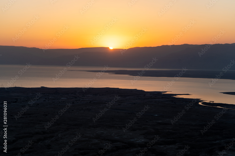 Sunrise from the top of Mount Masada in Israel near the Jordan border. Location of ancient Roman Israeli War, ending in mass suicide. Sunrise from the top of Mount Masada in Israel near the Jordan border. Location of ancient Roman Israeli War, ending in mass suicide.