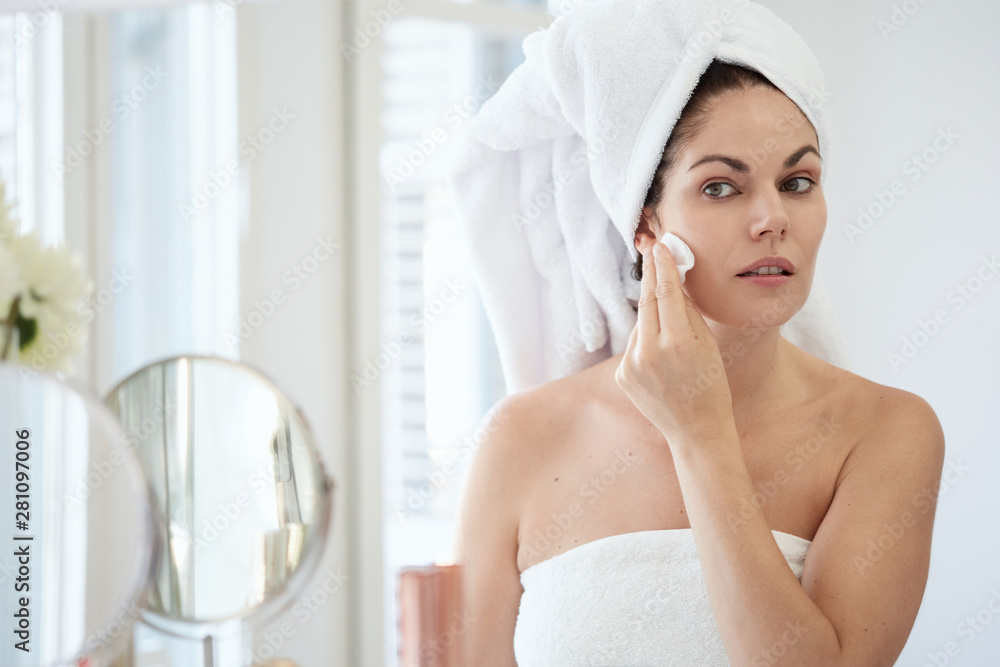 Woman using skincare products. Woman using skincare products.