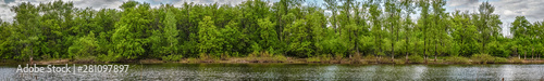 Panorama of the lake with a forest on opposite shore