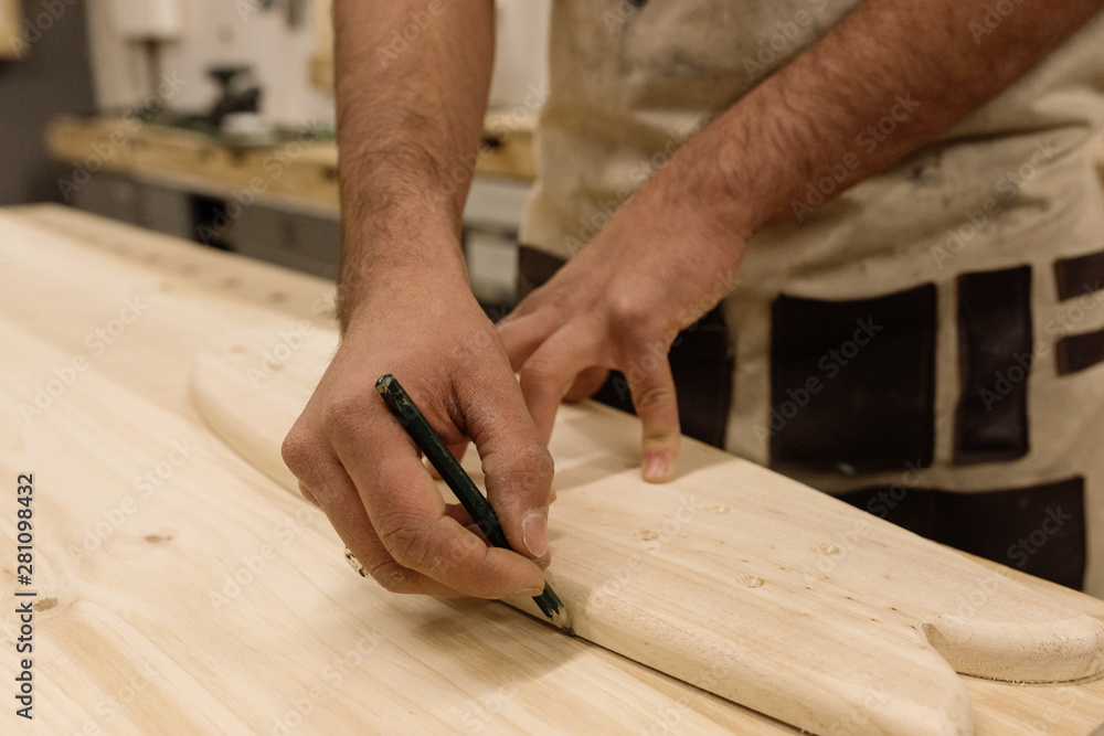 Hands encircling piece of wood Hands encircling piece of wood