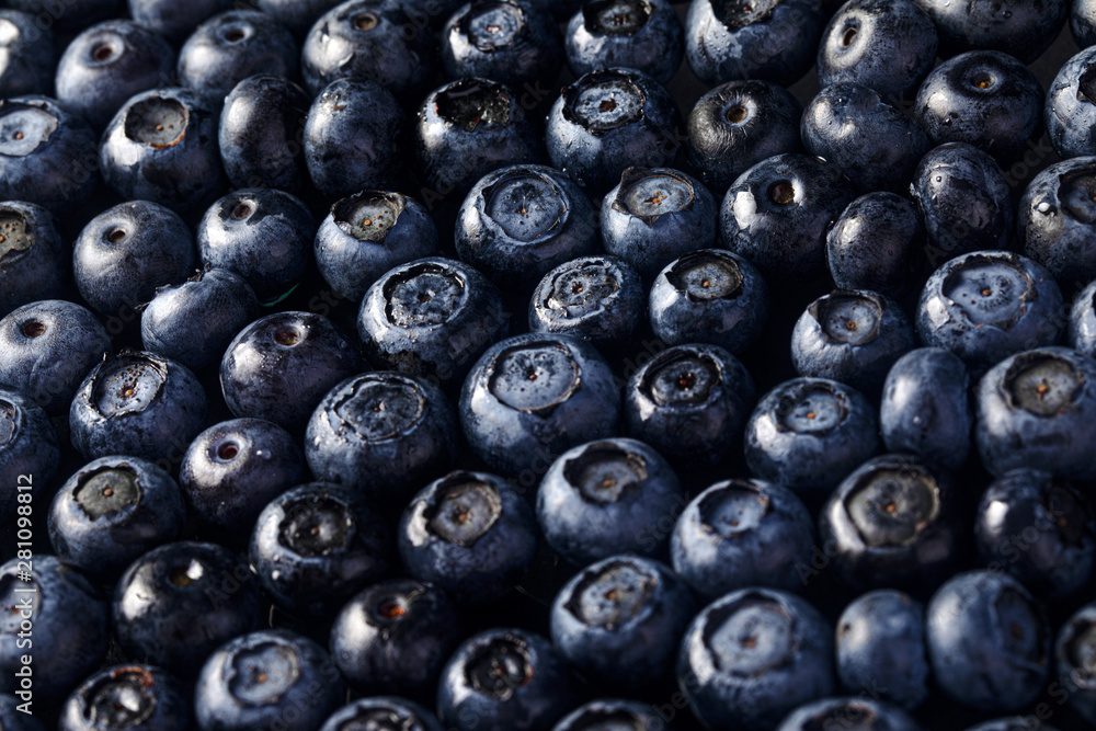 Heap of fresh raw american blueberries or huckleberries, blue berries background Heap of fresh raw american blueberries or huckleberries, blue berries background