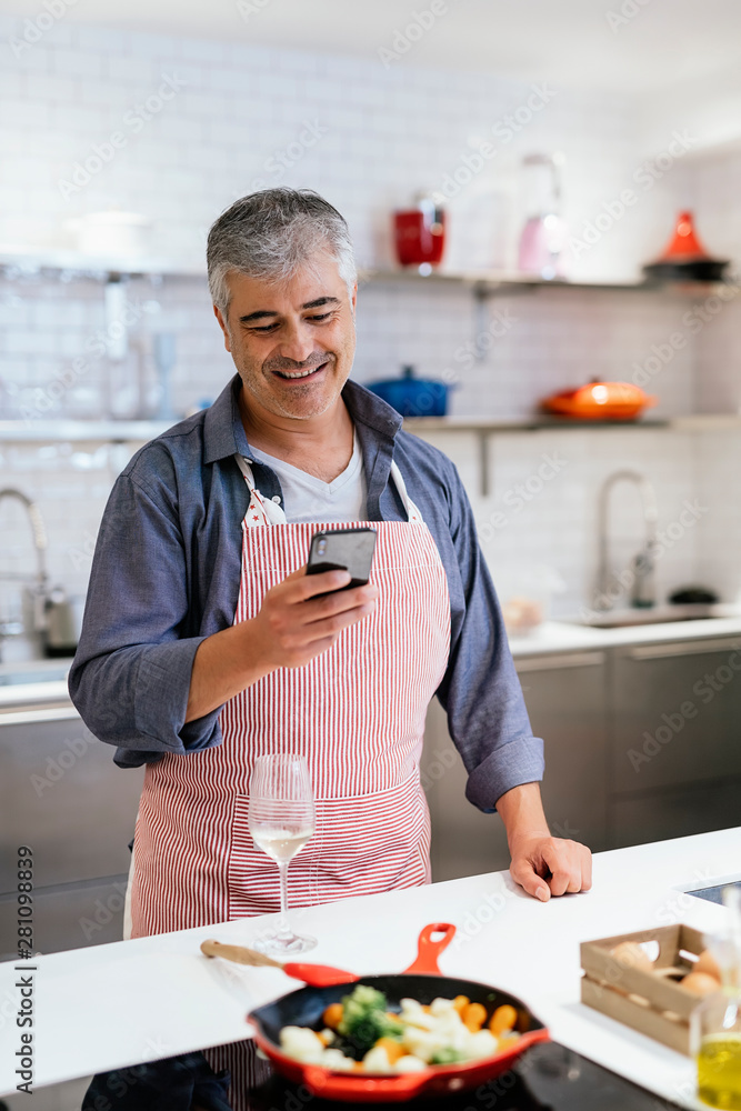 Adult handsome man using mobile phone Adult handsome man using mobile phone