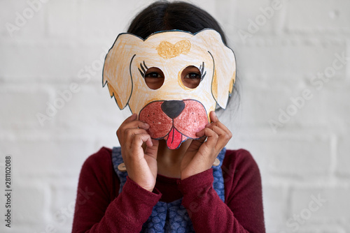 Cute indian girl with homemade animal mask photo