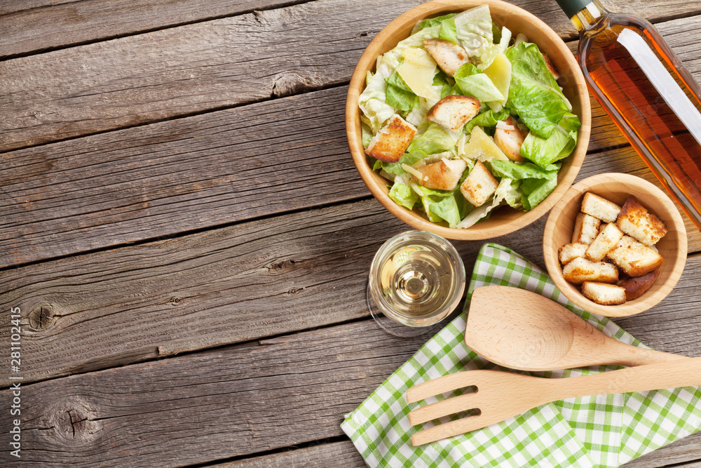 Fresh healthy salad and white wine Fresh healthy salad and white wine