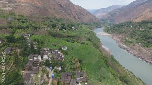 Aerial view of a village in China near the river in Yongji photo