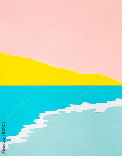 Cut paper collage of a sea with mountain behind.