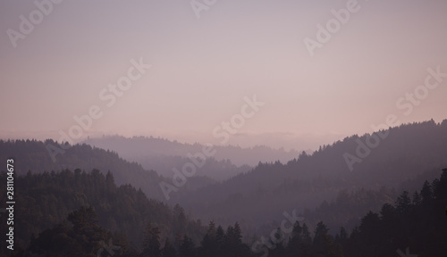 Layers of a hazy mountain range photo