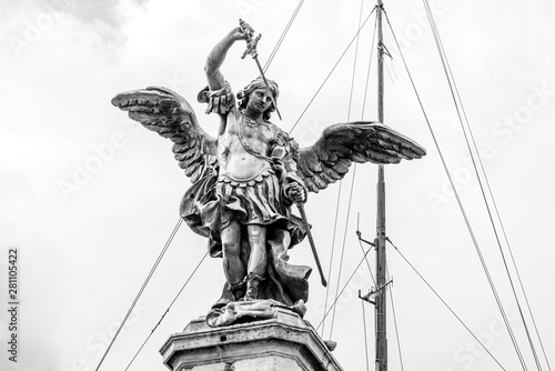 Bronze statue of Michael the Archangel on the top of the Castel Sant'Angelo, Rome, Italy photo