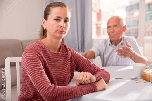 Mature father soothes adult daughter