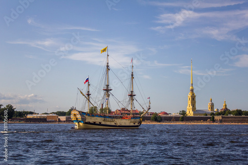 ancient Russian military sailing ship Poltava on the parade in Saint Petersburg in the Neva River against the background of the Peter and Paul