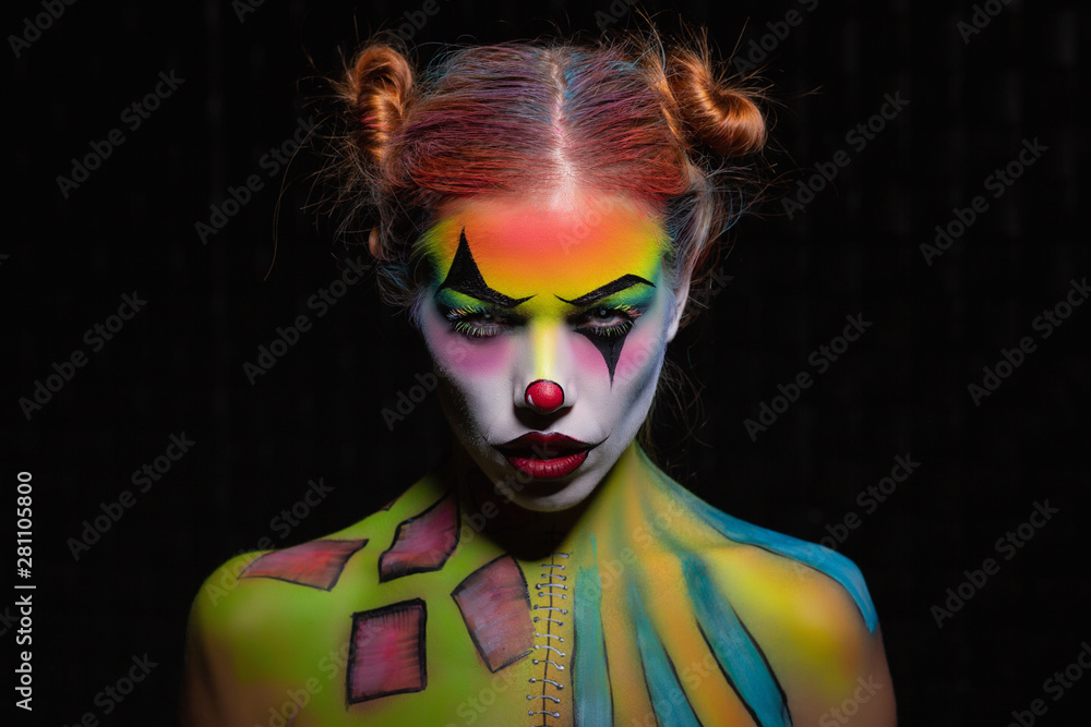 Attractive young woman with a face painting.