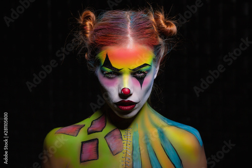 Attractive young woman with a face painting.